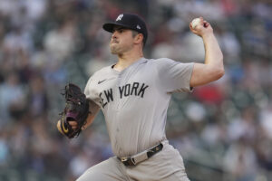 New York Yankees starting pitcher Carlos Rodón delivers during the first inning of a baseball game against the Minnesota Twins, Tuesday, May 14, 2024, in Minneapolis.