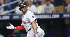 ST PETERSBURG, FLORIDA - MAY 20: Rafael Devers #11 of the Boston Red Sox reacts after hitting a two run home run during the third inning against the Tampa Bay Rays continuing his home run streak to six games in a row at Tropicana Field on May 20, 2024 in St Petersburg, Florida. 