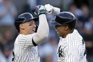 New York Yankees’ Juan Soto celebrates with Aaron Judge, left, after hitting a two-run home run against the Houston Astros during the first inning of a baseball game Wednesday, May 8, 2024, in New York.