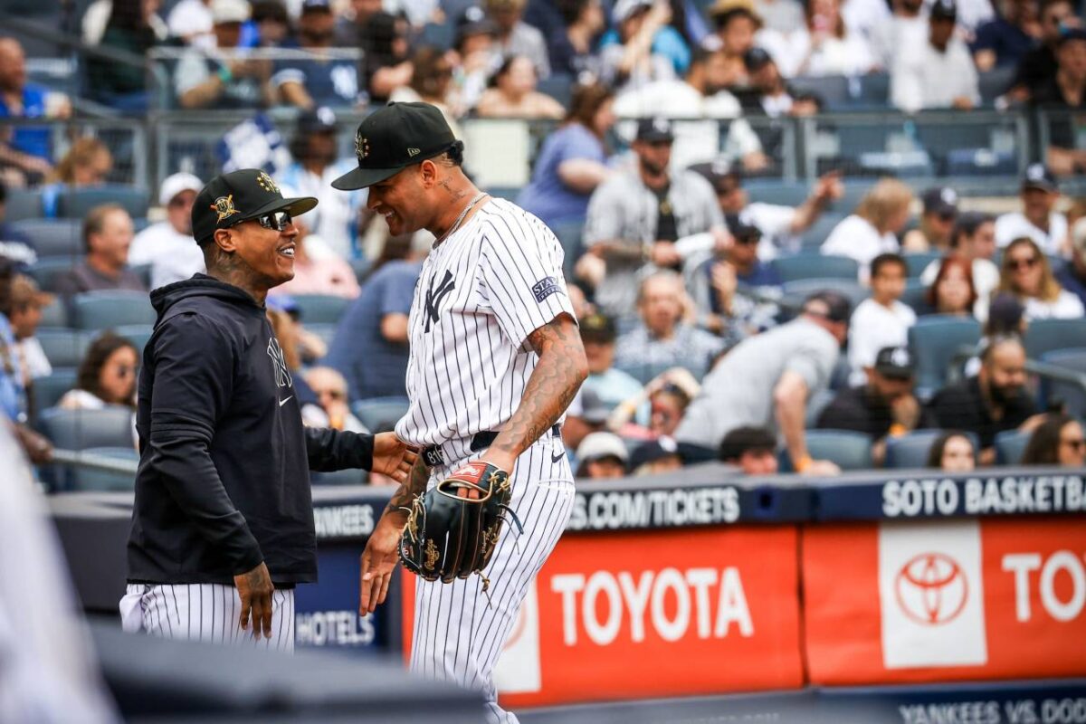 Yankees' Marcus Stroman welcomes Luis Gil to dugout after his his 14-K's game vs. the White Sox on May 18, 2024, at Yankee Stadium.