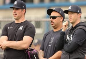 Carlos Rodon and Nestor Cortes are with Yankees' pitching coach Matt Blake during the 2024 spring training camp in Tampa.