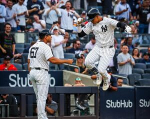 Yankees’ Juan Soto jumps after hitting a two-run home run against the Houston Astros during the first inning on May 8, 2024, in New York.