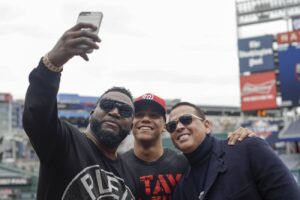 Alex Rodriguez and David Ortiz take a selfie with Washington Nationals’ Juan Soto before Game 3 of the baseball World Series against the Houston Astros Friday, Oct. 25, 2019, in Washington