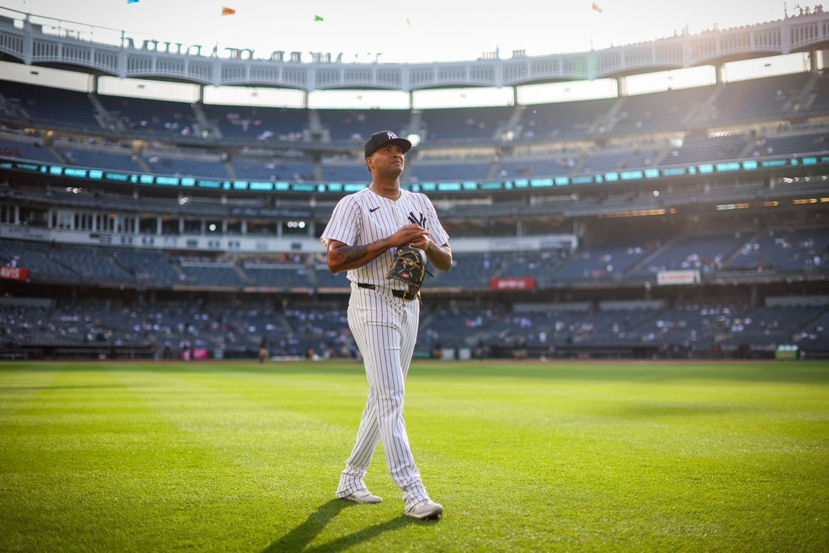 Yankees' Luis Gil is walking toward the mound at Yankee Stadium to pitch against the Dodgers on June 9, 2024.