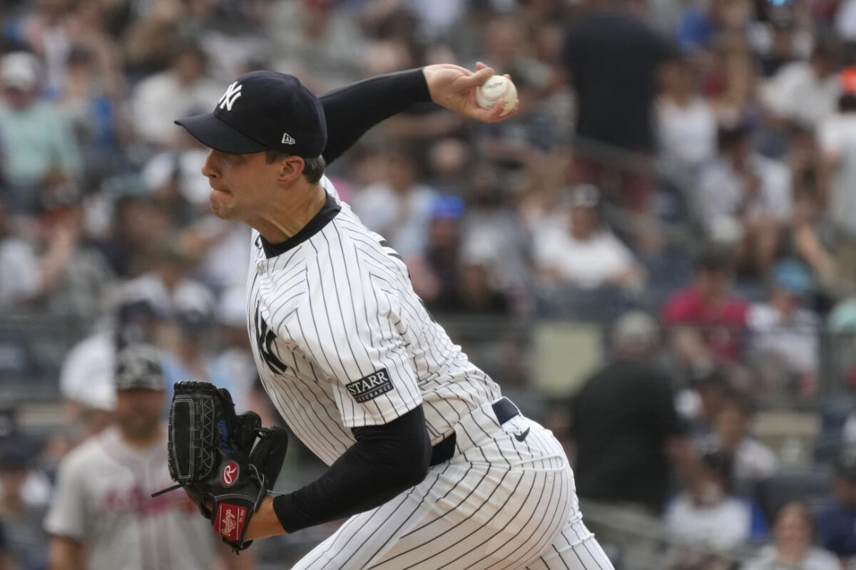 New York Yankees’ Tommy Kahnle pitches during the eighth inning of a baseball game against the Atlanta Braves, Sunday, June 23, 2024, in New York. 