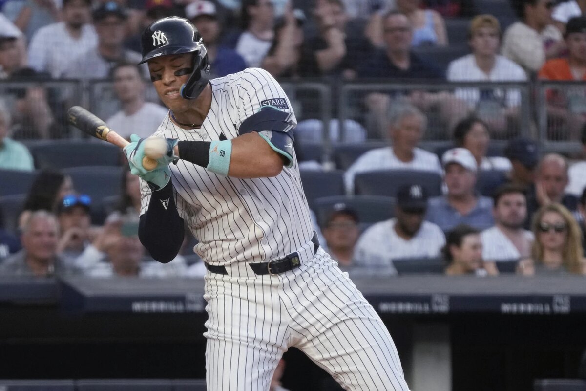 New York Yankees’ Aaron Judge reacts to getting hit by a pitch from Baltimore Orioles’ Albert Suárez during the third inning of a baseball game Tuesday, June 18, 2024, in New York.