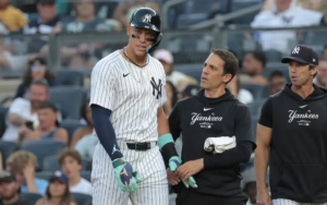 Yankees' Aaron Judge leaves the game after getting hit by a 94mph fastball against the Baltimore Orioles on 18th June, 2024.