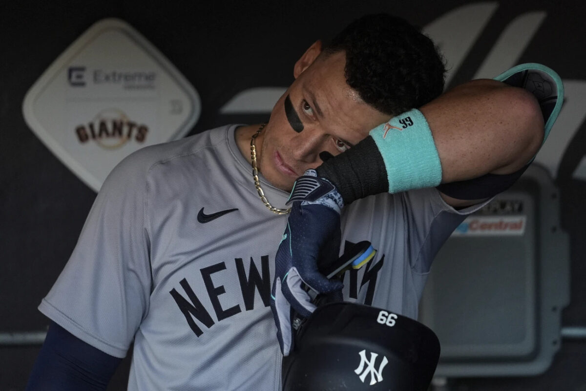 New York Yankees’ Aaron Judge wipes his face in the dugout before taking the field for a baseball game against the San Francisco Giants, Saturday, June 1, 2024, in San Francisco.