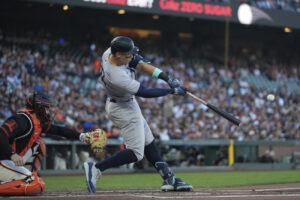 New York Yankees’ Aaron Judge, right, hits a two-run home run against the San Francisco Giants during the first inning of a baseball game Saturday, June 1, 2024, in San Francisco