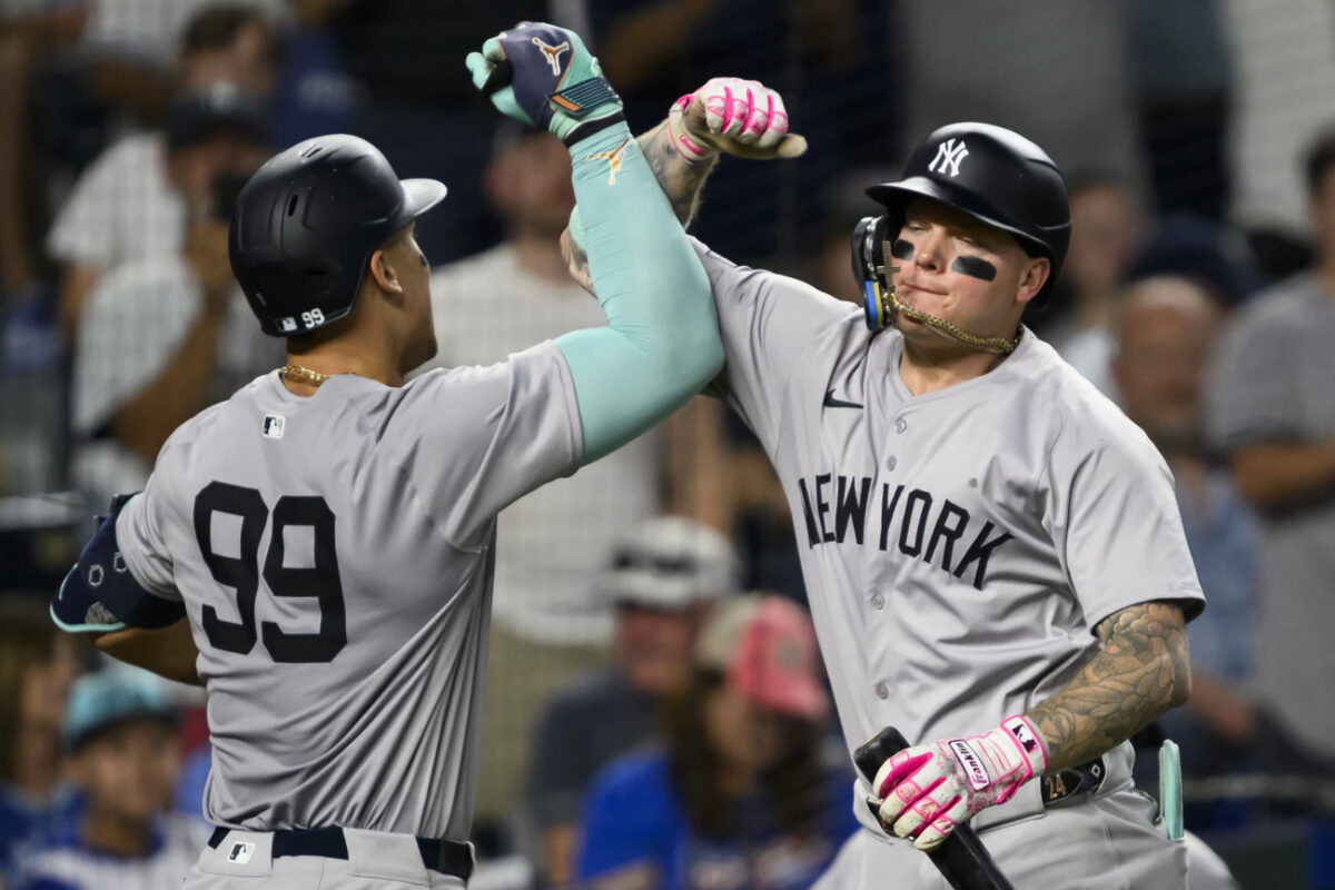New York Yankees’ Alex Verdugo, right, celebrates with New York Yankees’ Aaron Judge (99) after Judge hit a two-run home run against the Kansas City Royals during the seventh inning of a baseball game, Tuesday, June 11, 2024, in Kansas City, Mo.