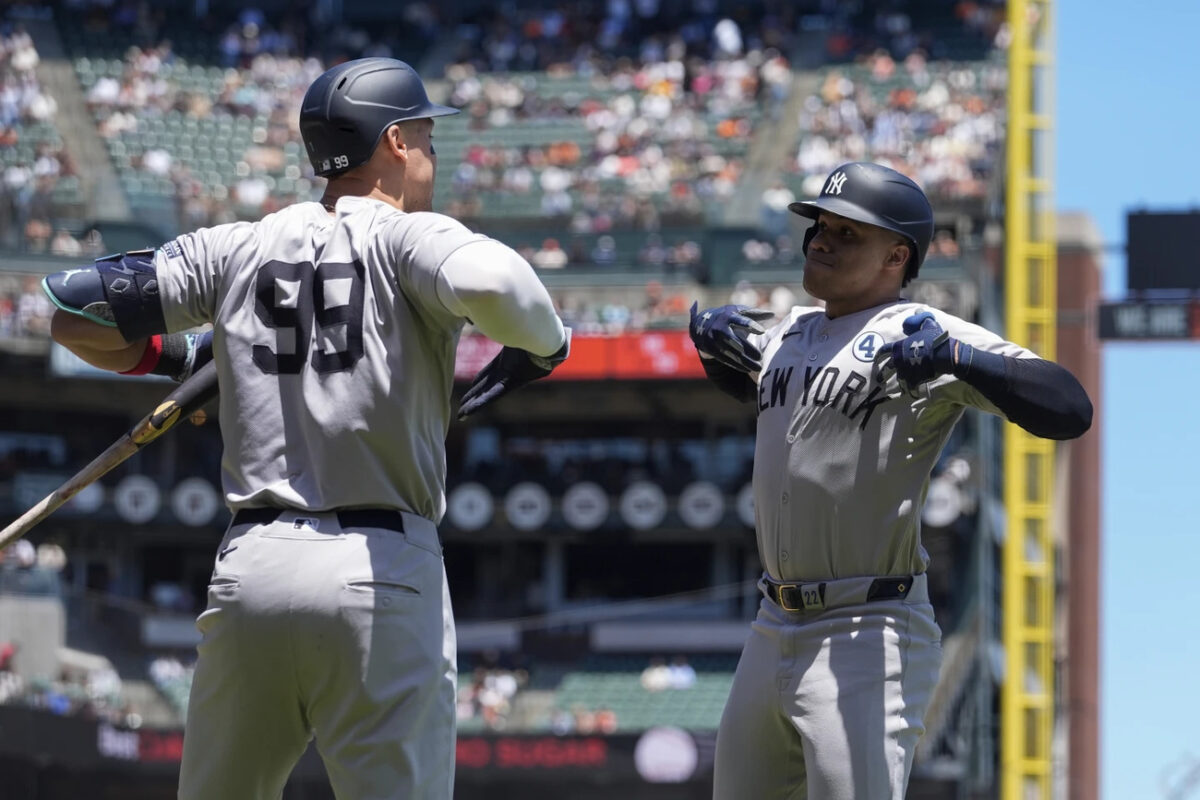 New York Yankees’ Juan Soto, right, celebrates with Aaron Judge, left, after hitting a solo home run against the San Francisco Giants during the first inning of a baseball game Sunday, June 2, 2024, in San Francisco.