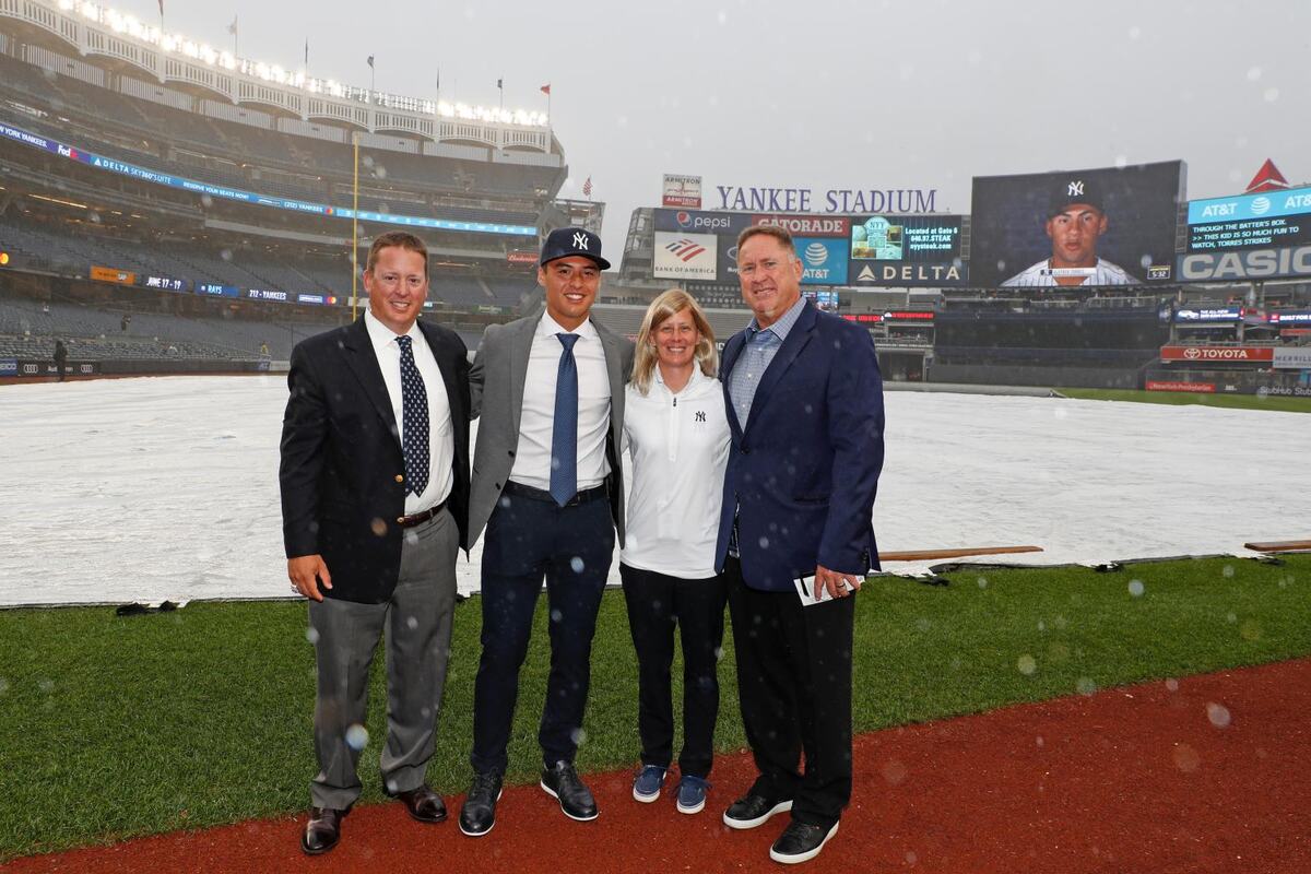 Yankees scout Matt Hyde is with Anthony Volpe and his parents.