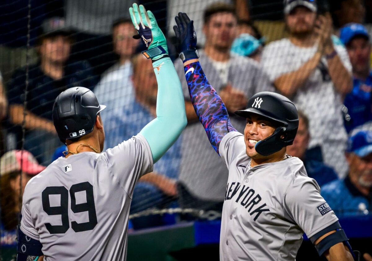 New York Yankees’ Aaron Judge and Giancarlo Stanton celebrate after former's home run against the Kansas City Royals, Tuesday, June 11, 2024, in Kansas City.