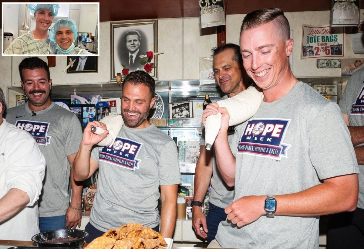 Austin Wells and Aaron Boone are with ex-trainers Mike Sole and Jon Becker as part of the Yankees' HOPE Week celebration on June 18, 2024.