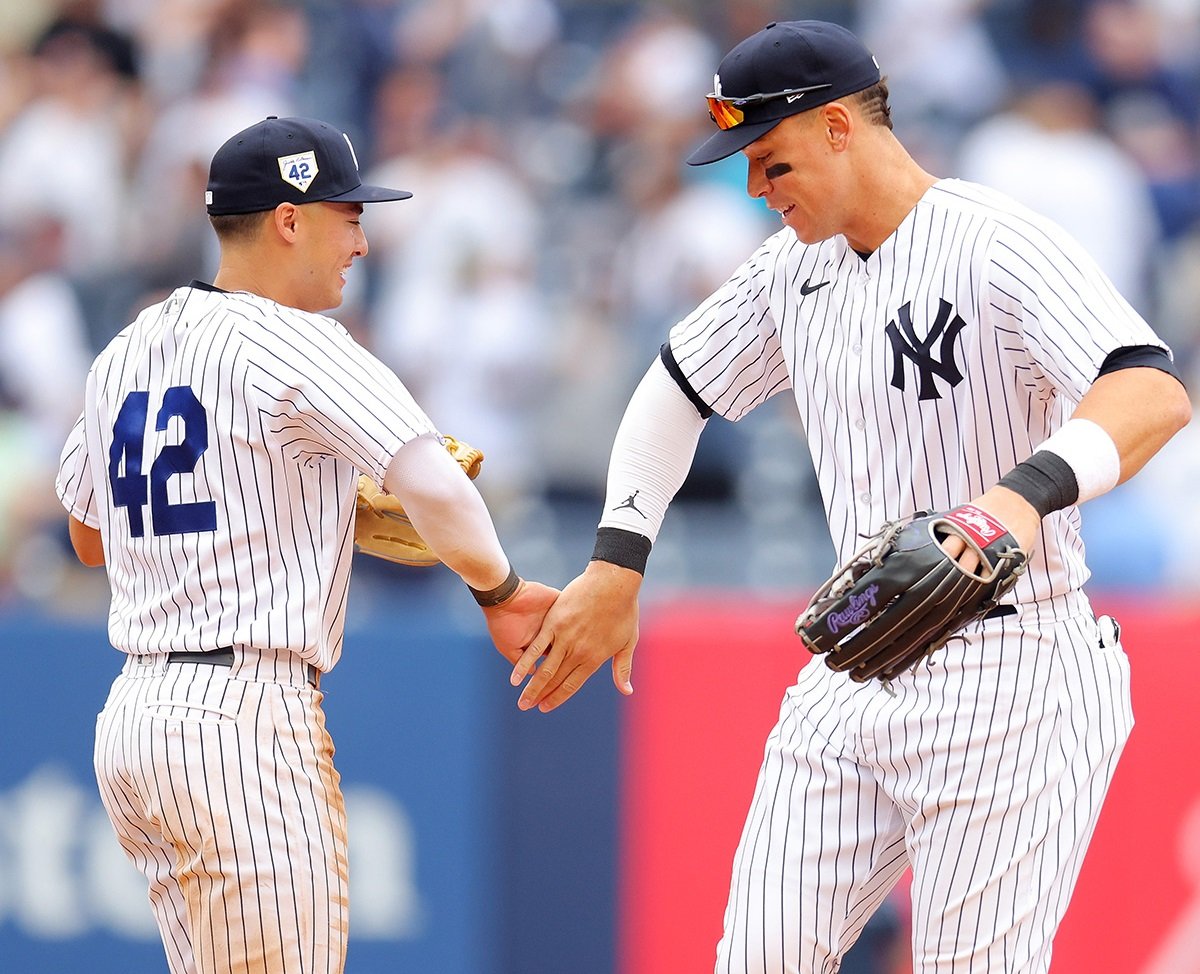 Yankees stars Anthony Volpe and Aaron Judge celebrate with the team's win on April 28, 2024, at Yankee Stadium.