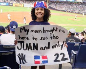 A young fan holds a poster saying he is at Yankees game only to see Juan Soto, Yankee Stadium, June 8, 2024.