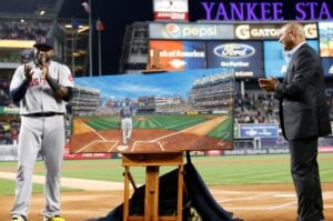 David Ortiz receives a painting from Yankees' legend Mariano Rivera on September 29, 2016, at Yankee Stadium.