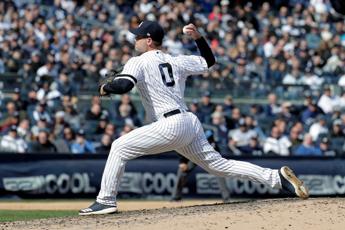 Yankees relief pitcher Adam Ottavino throws a pitch to the Orioles during the sixth inning at Yankee Stadium, Thursday, March 28, 2019, in New York.