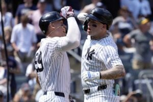 New York Yankees’ Aaron Judge, left, and Alex Verdugo celebrate after Verdugo hit a home run during the third inning of a baseball game against the Boston Red Sox, Saturday, July 6, 2024, in New York.