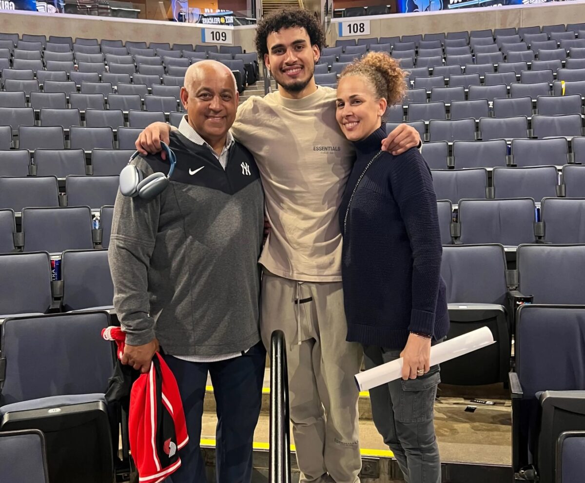 Omar Minaya and his wife Rachel are with his son Justin in 2023.