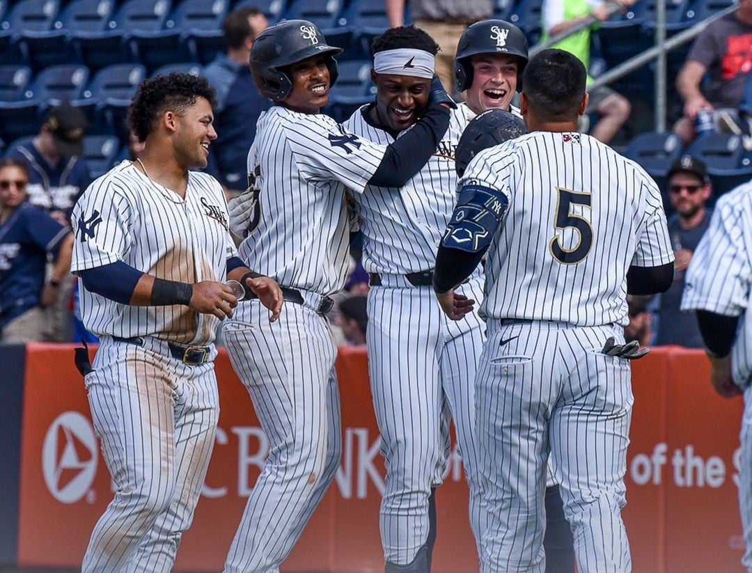 Yankees rookies at the Triple-A RailRiders celebrate following a walk-off win on June 10, 2024.