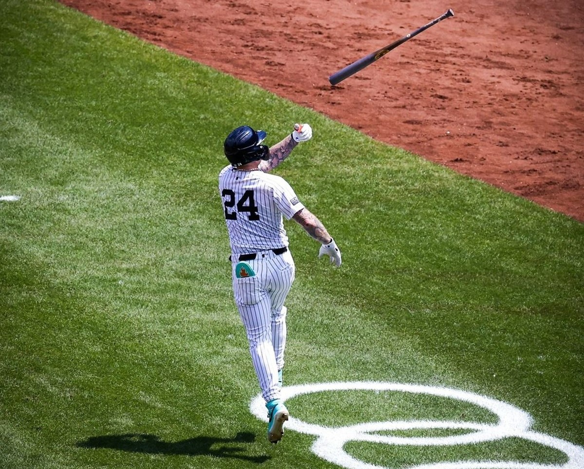 Yankees' Alex Verdugo flip his bat after hitting a home run 