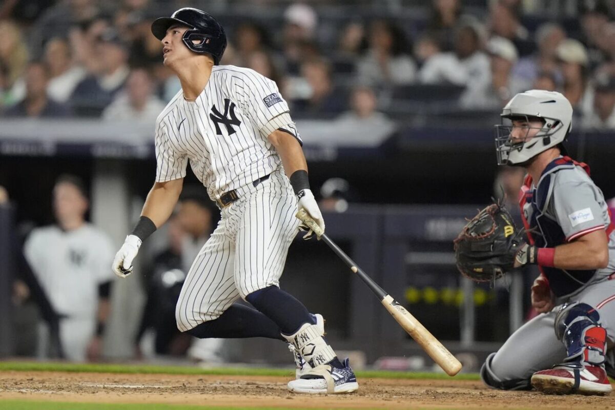 New York Yankees’ Anthony Volpe follows through on a two-run double during the seventh inning of a baseball game against the Cincinnati Reds, Wednesday, July 3, 2024, in New York.