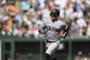 New York Yankees’ Austin Wells runs the bases after hitting a three-run home run off Baltimore Orioles pitcher Grayson Rodriguez during the first inning of a baseball game, Saturday, July 13, 2024, in Baltimore.