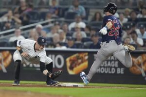 Boston Red Sox’s Romy Gonzalez (23) is thrown out at first base by New York Yankees pitcher Luke Weaver as Yankees’ Ben Rice, left, catches the ball during the seventh inning of a baseball game, Friday, July 5, 2024, in New York.