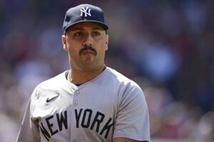 New York Yankees starting pitcher Nestor Cortes walks to the dugout after being removed in the fifth inning of a baseball game against the Cleveland Guardians, Sunday, April 14, 2024, in Cleveland.