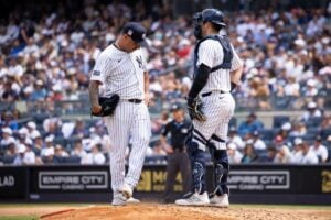 Yankees' pitcher Nestor Cortes is talking to catcher Austin Wells during the game against the Rays on July 20, 2024, in New York.