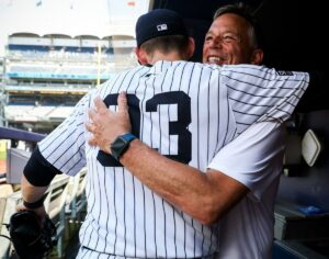 Yankees’ Ben Rice hugs his father Dan after hitting three home runs against the Red Sox on July 6, 2024, in New York.