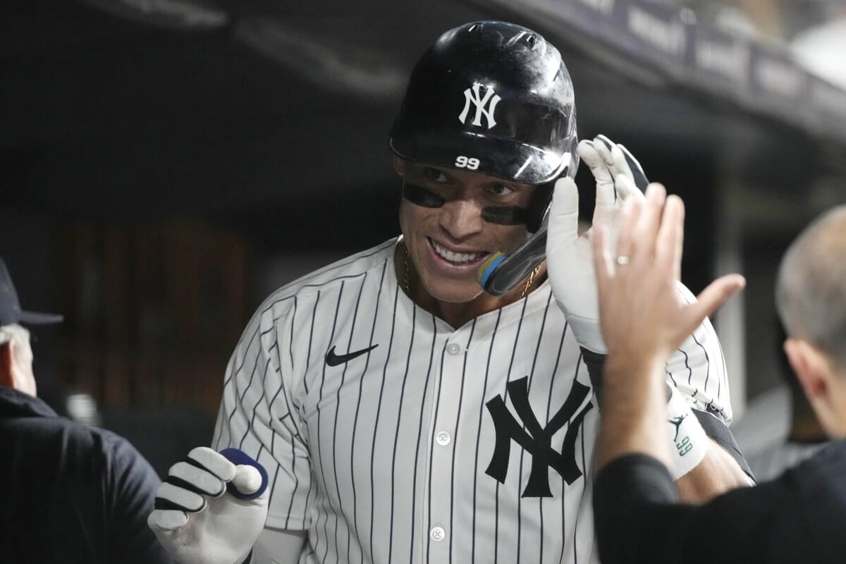 New York Yankees’ Aaron Judge celebrates in the dugout after hitting a home run during the sixth inning of a baseball game against the Colorado Rockies, Friday, Aug. 23, 2024, in New York.