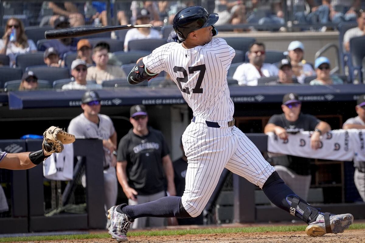 New York Yankees’ Giancarlo Stanton breaks his bat as he hits a single during the fifth inning of a baseball game against the Colorado Rockies, Sunday, Aug. 25, 2024, in New York. 