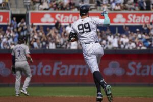 New York Yankees’ Aaron Judge (99) runs the bases after hitting a home run during the first inning of a baseball game against the Colorado Rockies, Sunday, Aug. 25, 2024, in New York.