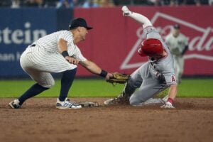 New York Yankees shortstop Anthony Volpe tags out Los Angeles Angels’ Mickey Moniak trying to stretch a single into a double during the fifth inning of a baseball game, Thursday, Aug. 8, 2024, in New York.