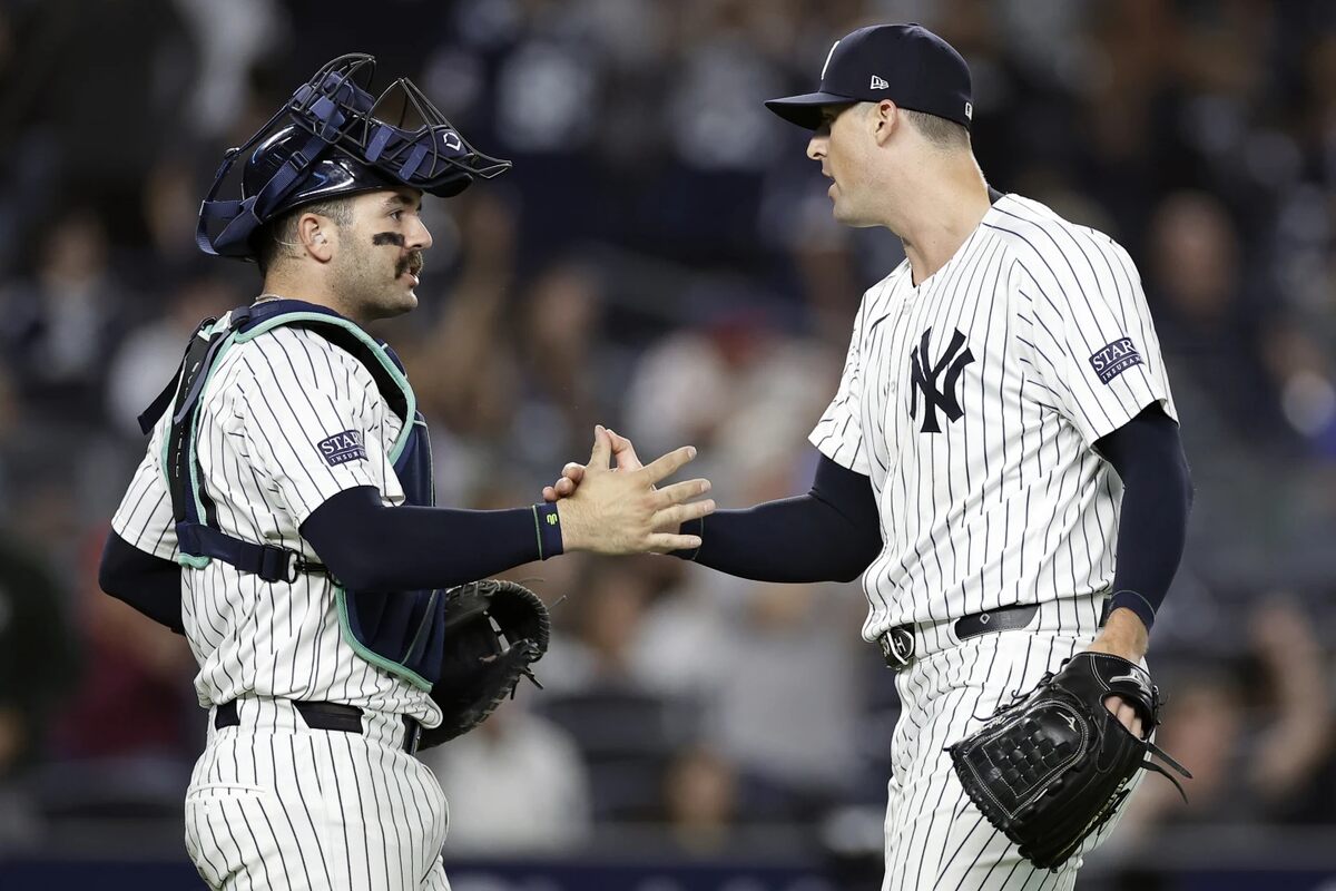 New York Yankees relief pitcher Clay Holmes, right, and catcher Austin Wells, right, congratulate each other after a baseball game against the St. Louis Cardinals, Friday, Aug. 30, 2024, in New York. 