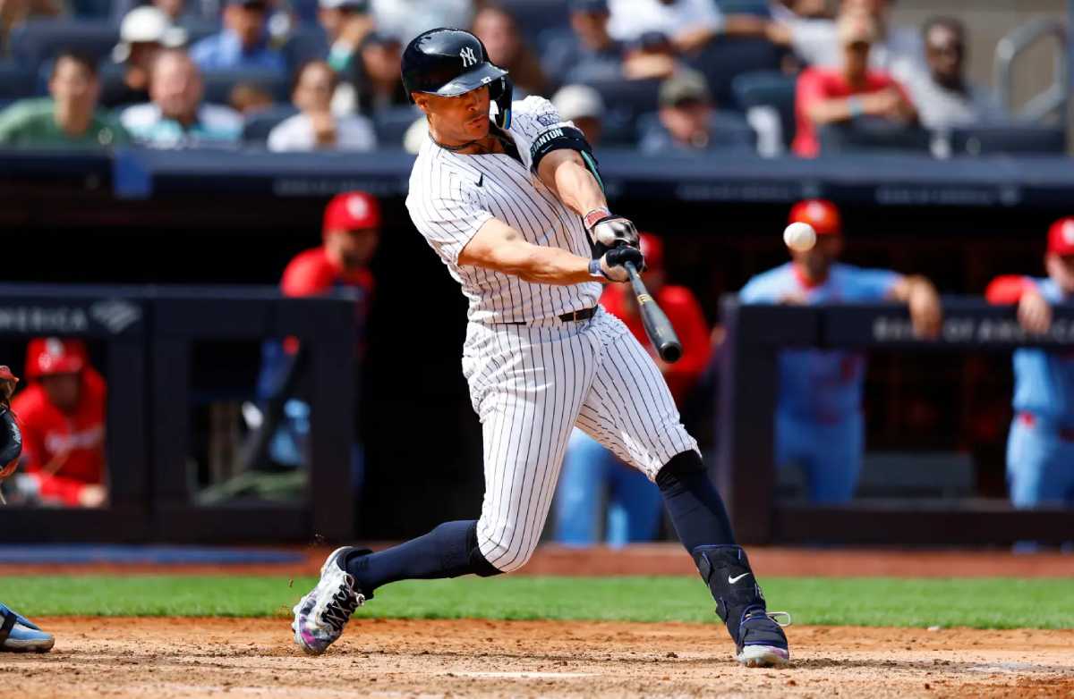 New York Yankees designated hitter Giancarlo Stanton hits an RBI double against the St. Louis Cardinals during the eighth inning of a baseball game, Saturday, Aug. 31, 2024.