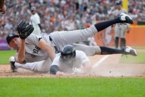 New York Yankees pitcher Tim Mayza tags out Detroit Tigers' Spencer Torkelson during the sixth inning of a baseball game, Saturday, Aug. 17, 2024, in Detroit.