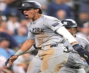 New York Yankees' Oswaldo Cabrera reacts after stealing three bases on a misfield by the White Sox on August 14, 2024, in Chicago.