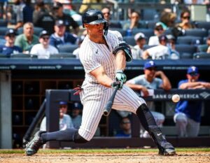 New York Yankees’ Giancarlo Stanton hits a home run in the fifth inning against the Texas Rangers, Sunday, Aug. 11, 2024, in New York.