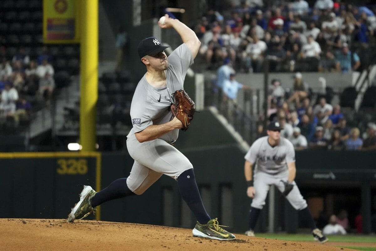 New York Yankees starting pitcher Carlos Rodon works against the Texas Rangers during the first inning of a baseball game Tuesday, Sept. 3, 2024, in Arlington, Texas.