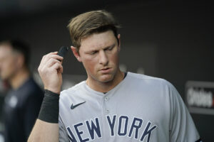 York Yankees third baseman DJ LeMahieu checks a PitchCom receiver prior to a baseball game against the Baltimore Orioles, Tuesday, May 17, 2022, in Baltimore.