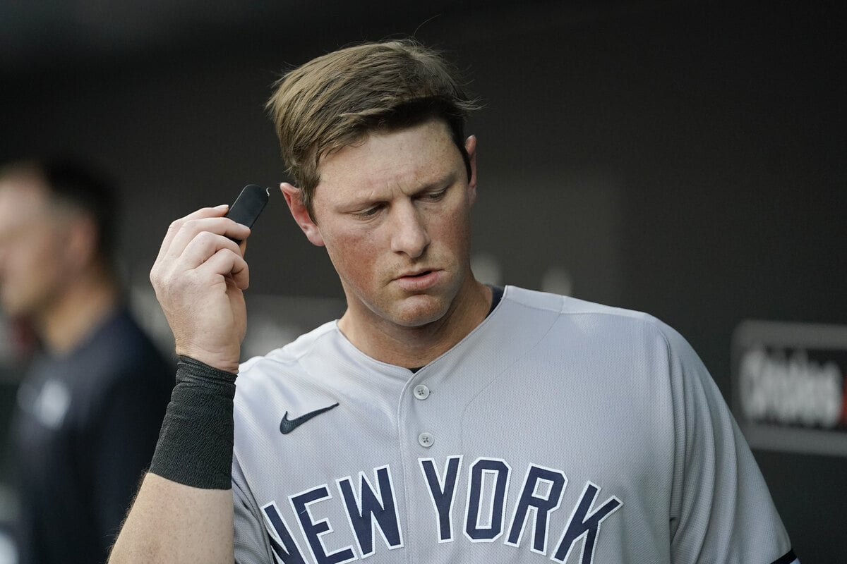 York Yankees third baseman DJ LeMahieu checks a PitchCom receiver prior to a baseball game against the Baltimore Orioles, Tuesday, May 17, 2022, in Baltimore. 