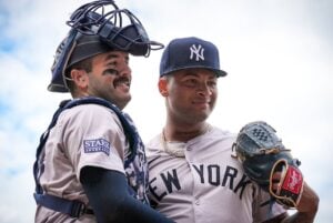 Yankees' Luis-Gil is with Austin Wells after his gem against the Cubs at Wrigley Field on September 6, 2024.