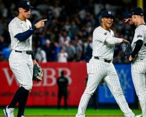 Aaron Judge, Juan Soto, and Luke Weaver celebrate the Yankees'