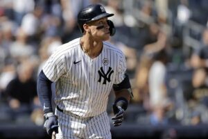 New York Yankees’ Aaron Judge watches his two-run home run during the third inning of a baseball game against the Boston Red Sox, Sunday, Sept. 15, 2024, in New York.