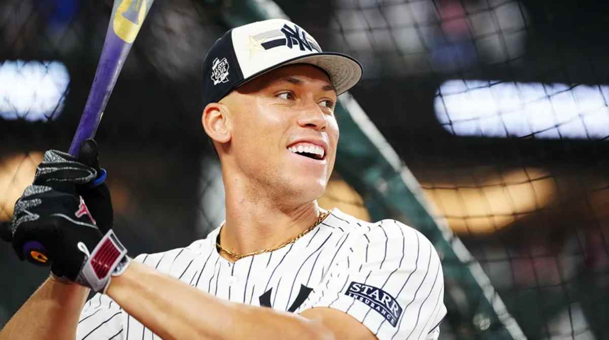 Aaron Judge, standing at home plate in his Yankees uniform, preparing for his next at-bat as he leads the home run race with 53 home runs.