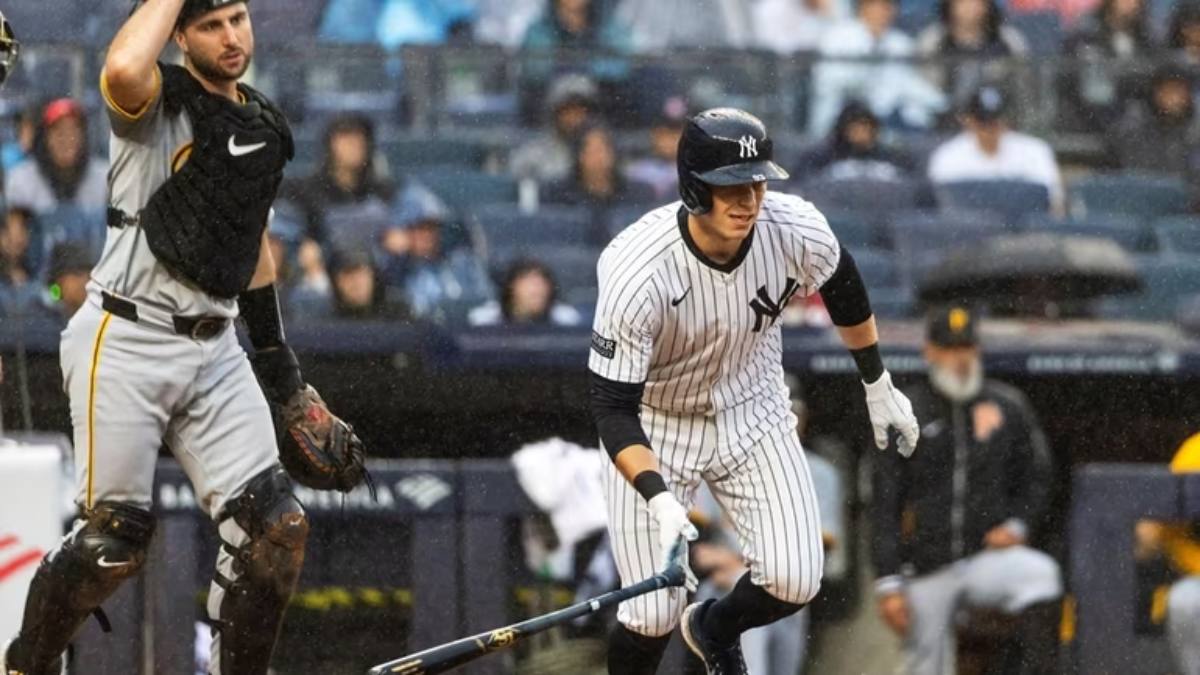 On September 29, 2024, Ben Rice runs to first base during the Yankees' rain-soaked final regular season game at Yankee Stadium