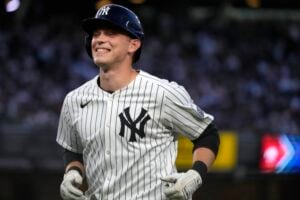 New York Yankees' Ben Rice reacts to fans cheering for him after flying out to Baltimore Orioles center fielder Cedric Mullins during the fourth inning of a baseball game, Wednesday, June 19, 2024, in New York.